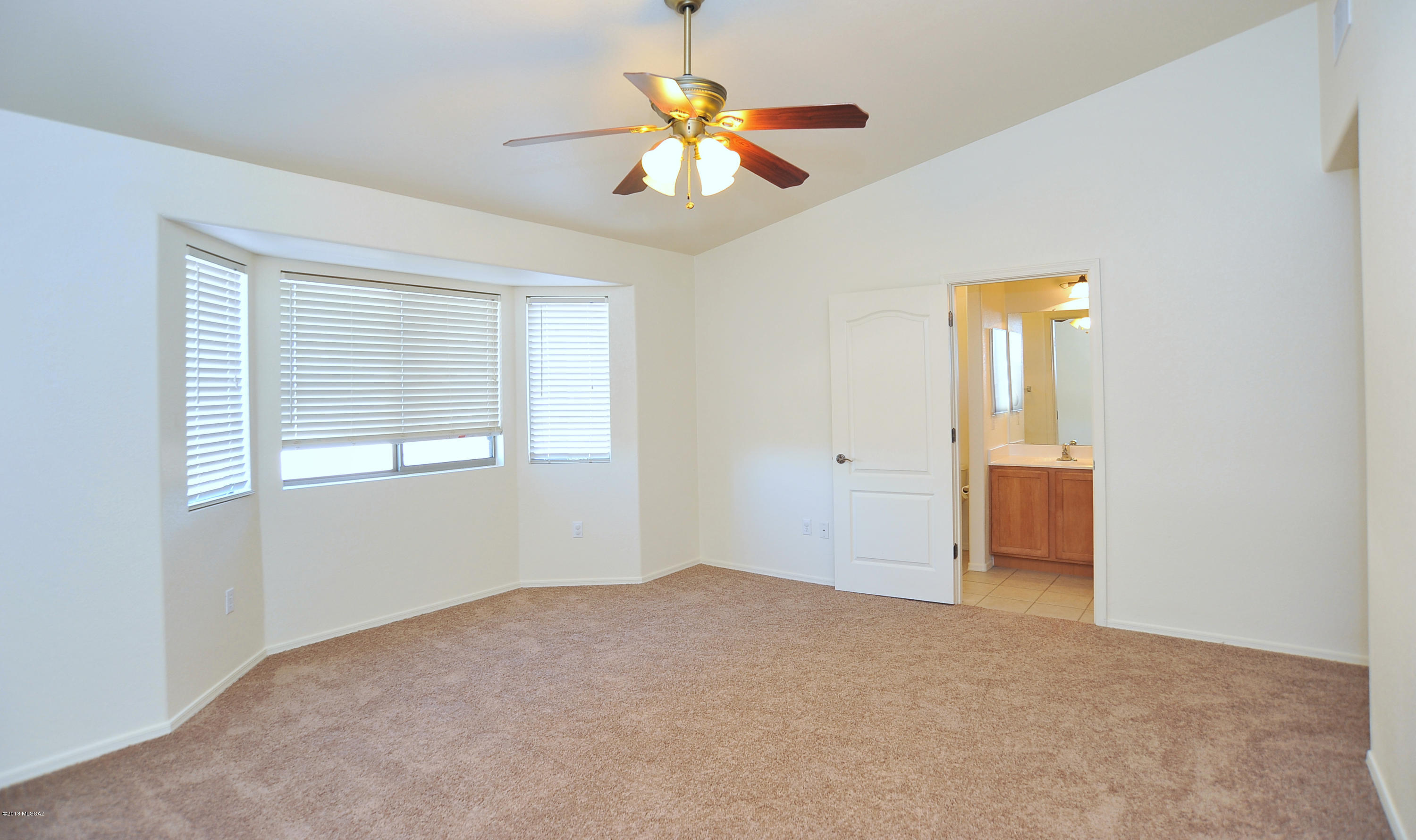 558 West Chatfield Street Vail, AZ 85641 - Photo 14 of 31 a view of an empty room with a window
