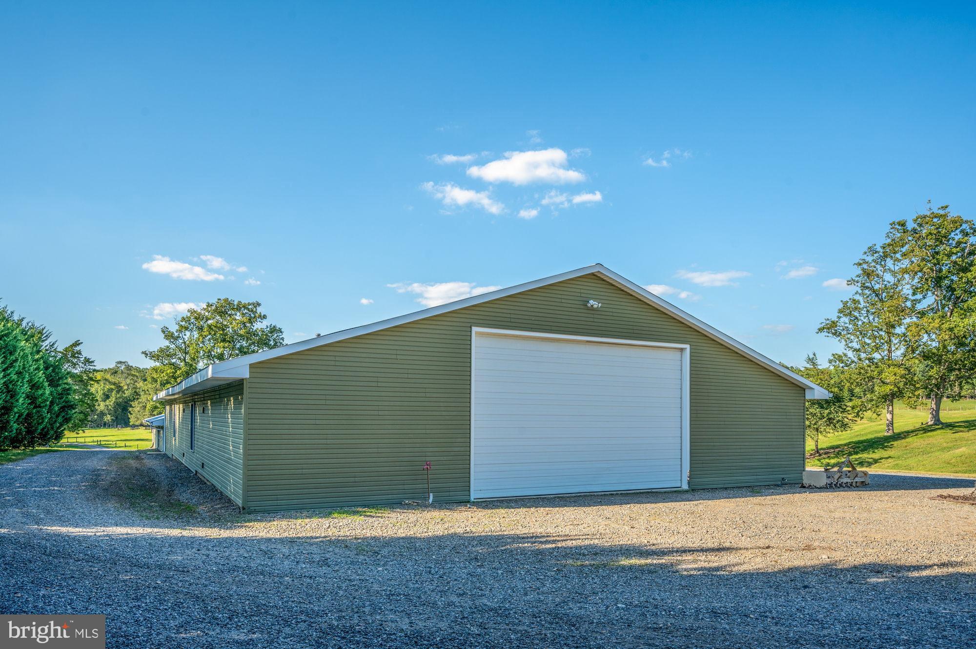 161 Forest Lane Road Fredericksburg, VA 22405 - Photo 57 of 99 a front view of a house with a yard and garage
