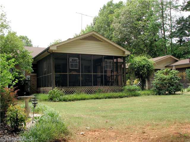 400 Grenham Road Greensboro, NC 27455 - Photo 12 of 15 Exterior Back. The screen porch and all brick construction plus the 1.18 acres make this a very desirable property. You will enjoy walking around in the yard.