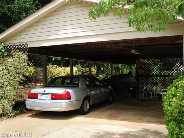 400 Grenham Road Greensboro, NC 27455 - Photo 13 of 15 Parking Lot/Garage. This is a generous carport with space for a wood working projects, protected from the weather or to store your boat or camper. Easily accomodates 2 cars, and has a covered entry into the house.