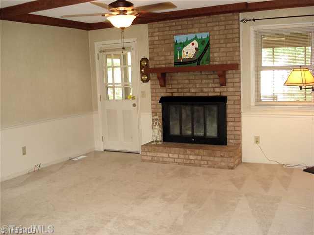 400 Grenham Road Greensboro, NC 27455 - Photo 3 of 15 Den/Family/Great Room. The Great Room has a gas log fireplace and opens unto a beautiful screen porch.