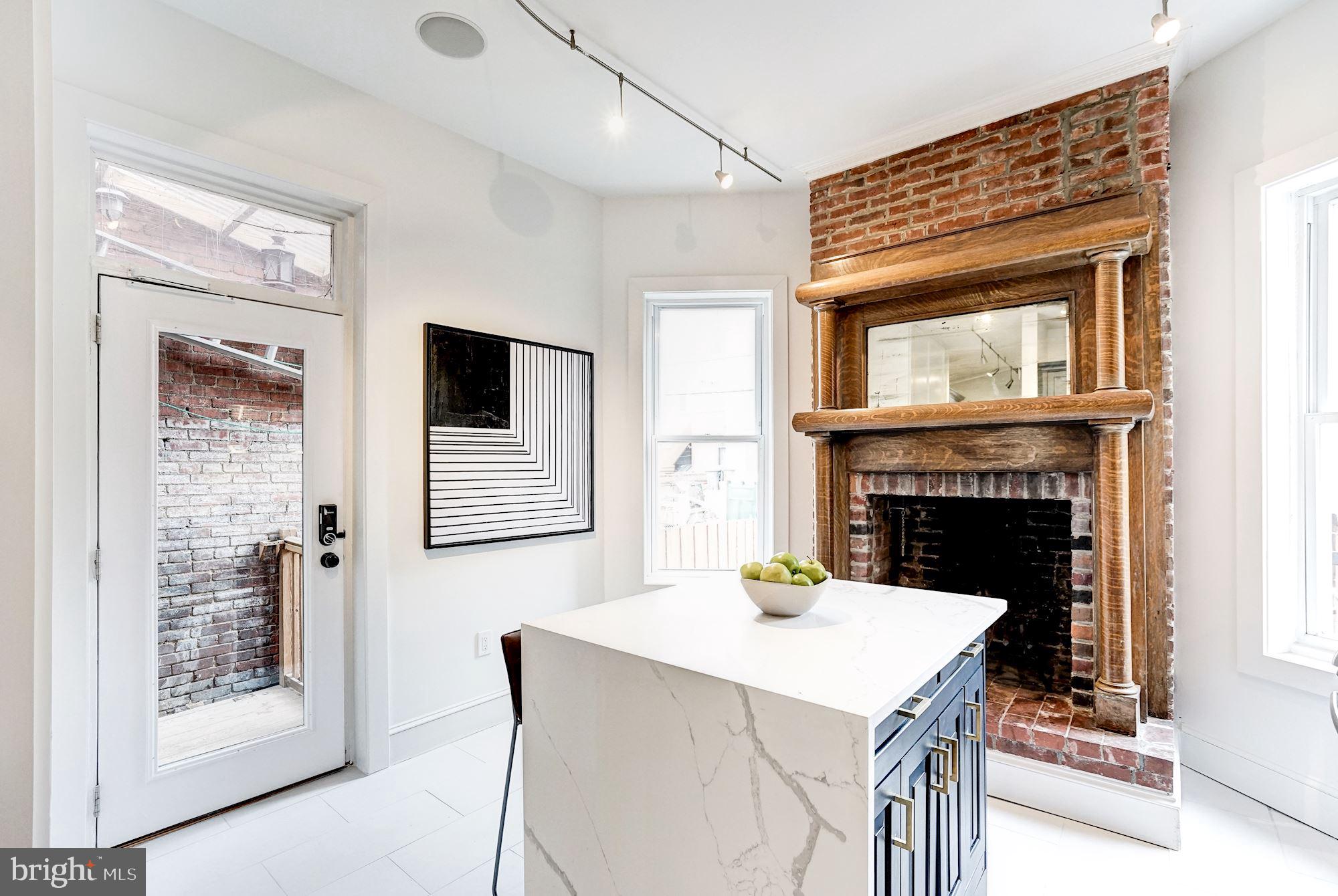 1332 Riggs Street Northwest Washington, DC 20009 - Photo 12 of 36 Period FP, waterfall island & access to deck