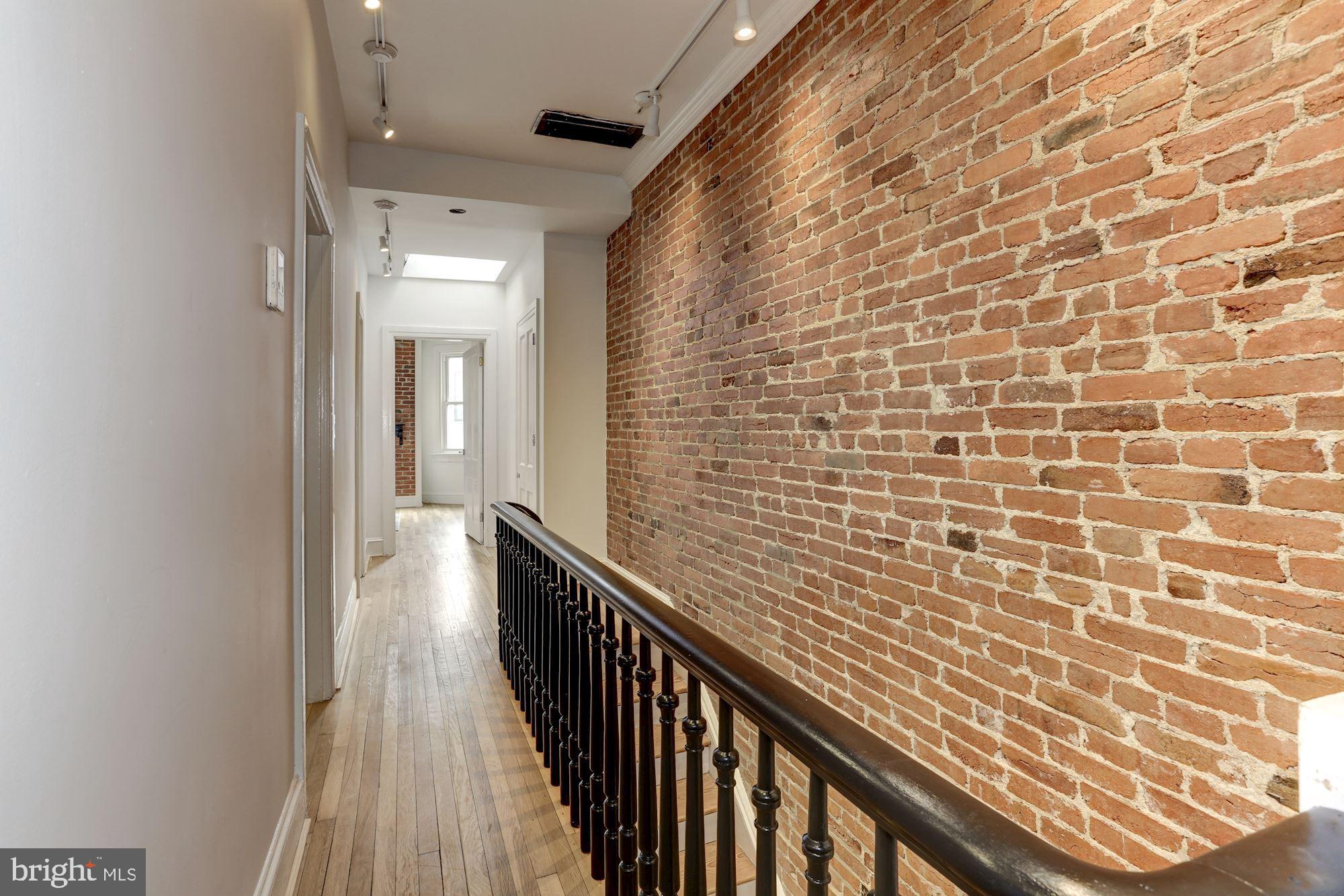 1332 Riggs Street Northwest Washington, DC 20009 - Photo 15 of 36 Exposed brick walls throughout