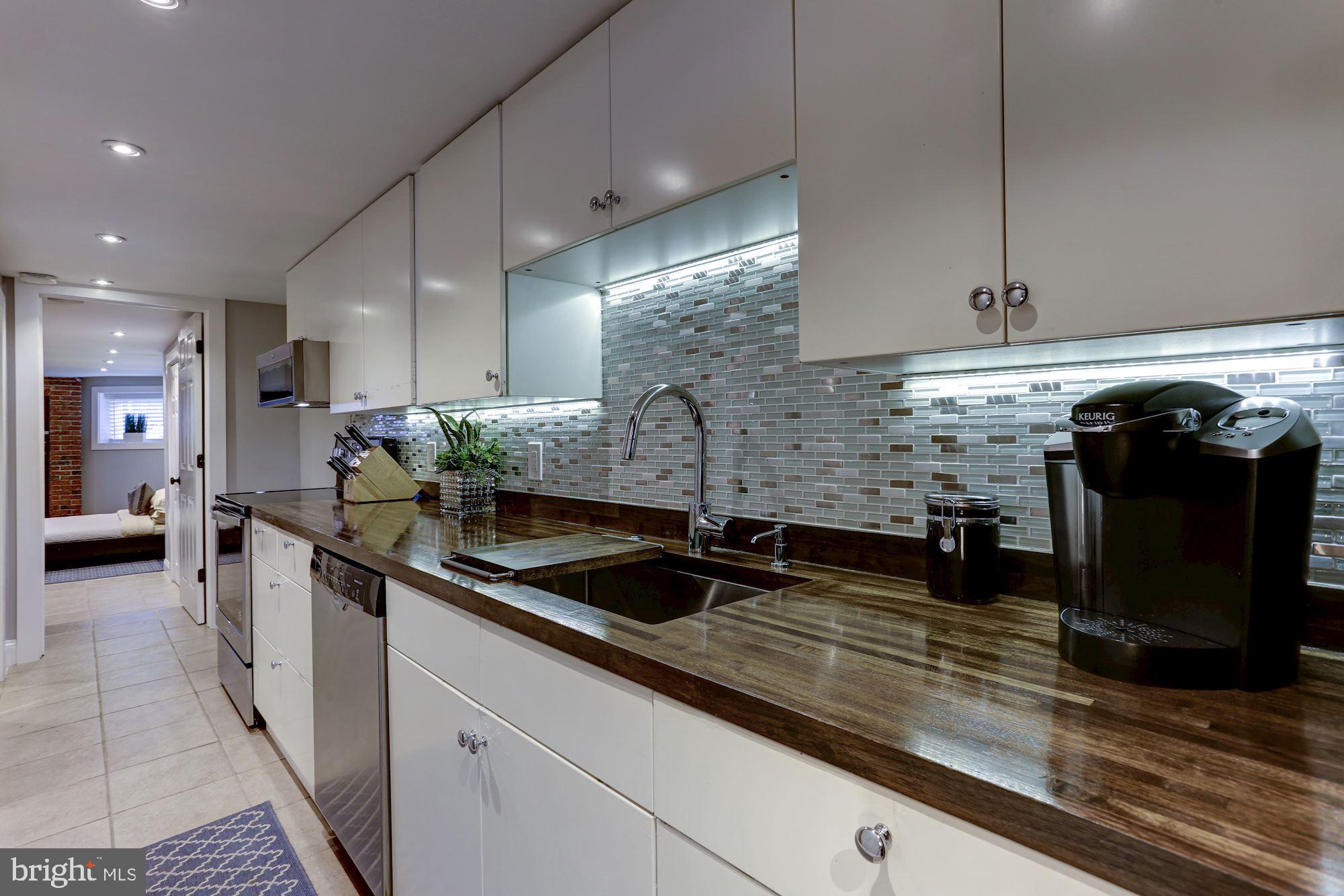 1332 Riggs Street Northwest Washington, DC 20009 - Photo 27 of 36 Well-appointed kitchen w/glass tile backsplash