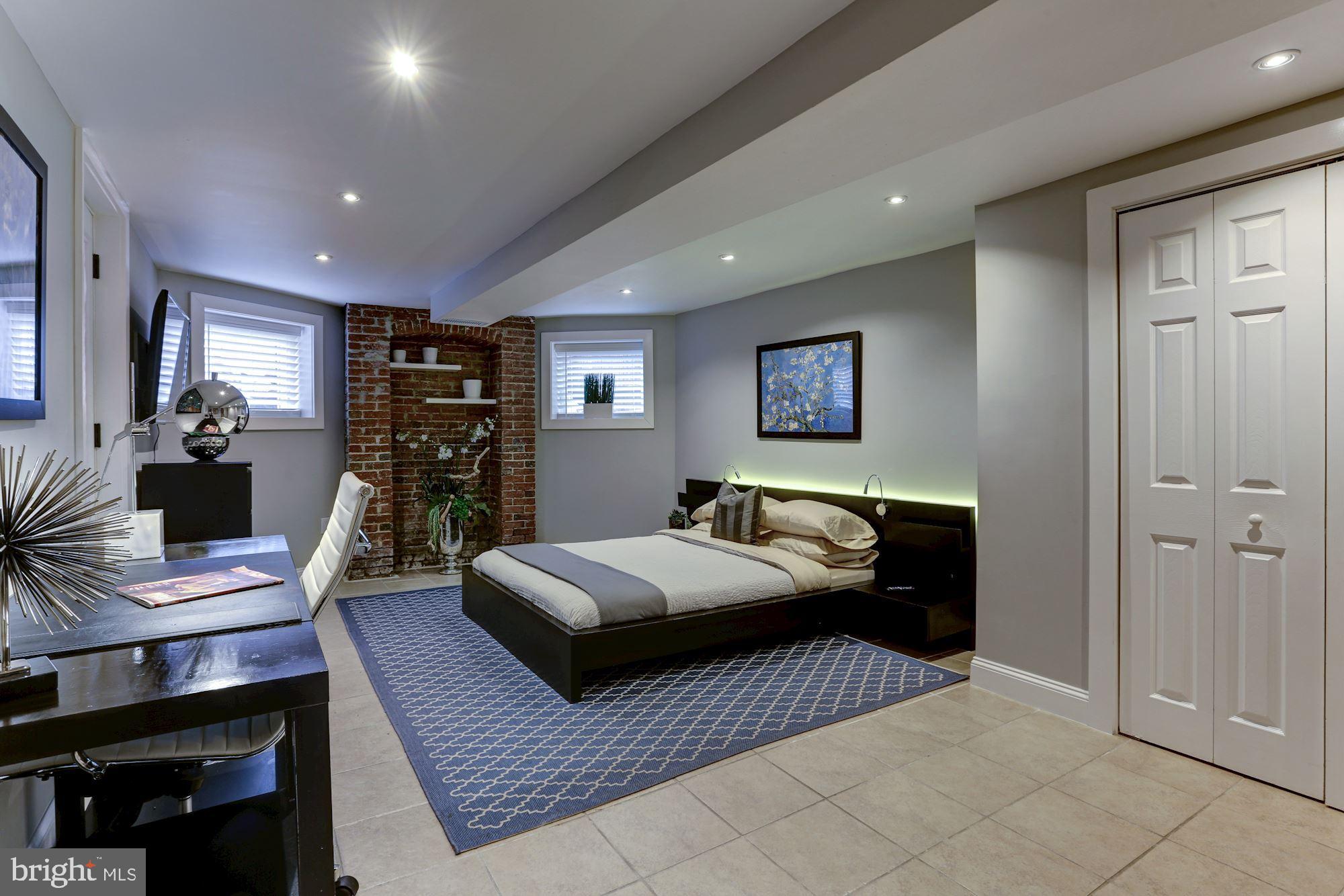 1332 Riggs Street Northwest Washington, DC 20009 - Photo 29 of 36 Large Rear Bedroom w/exposed brick wall