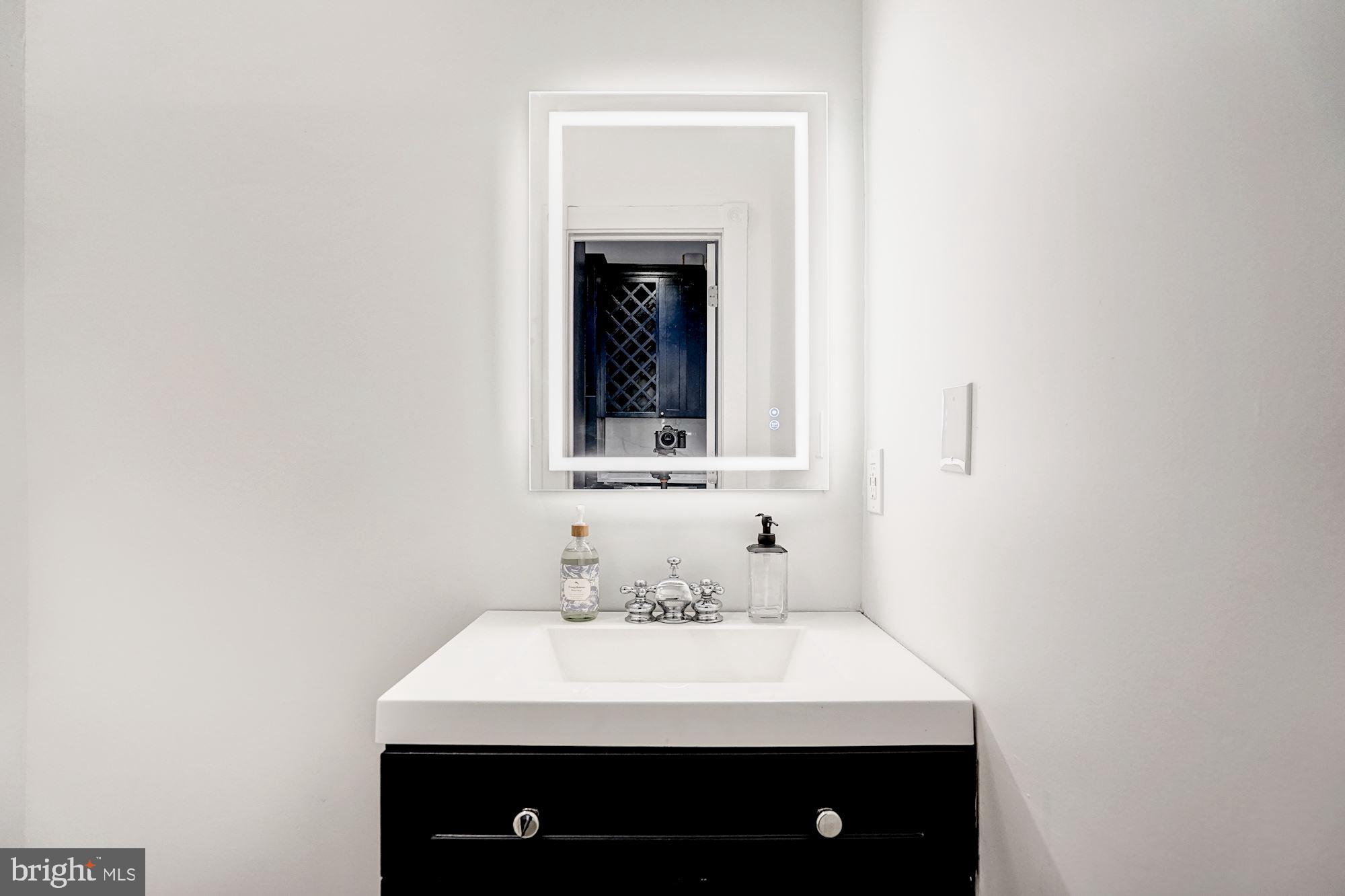 1332 Riggs Street Northwest Washington, DC 20009 - Photo 10 of 36 Main level powder room w/ smart/green lighting