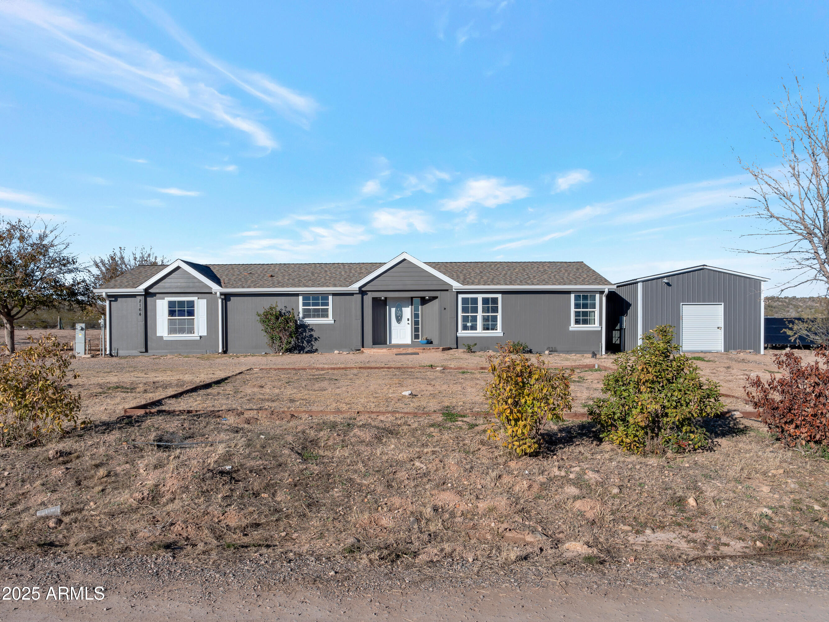 a front view of a house with yard