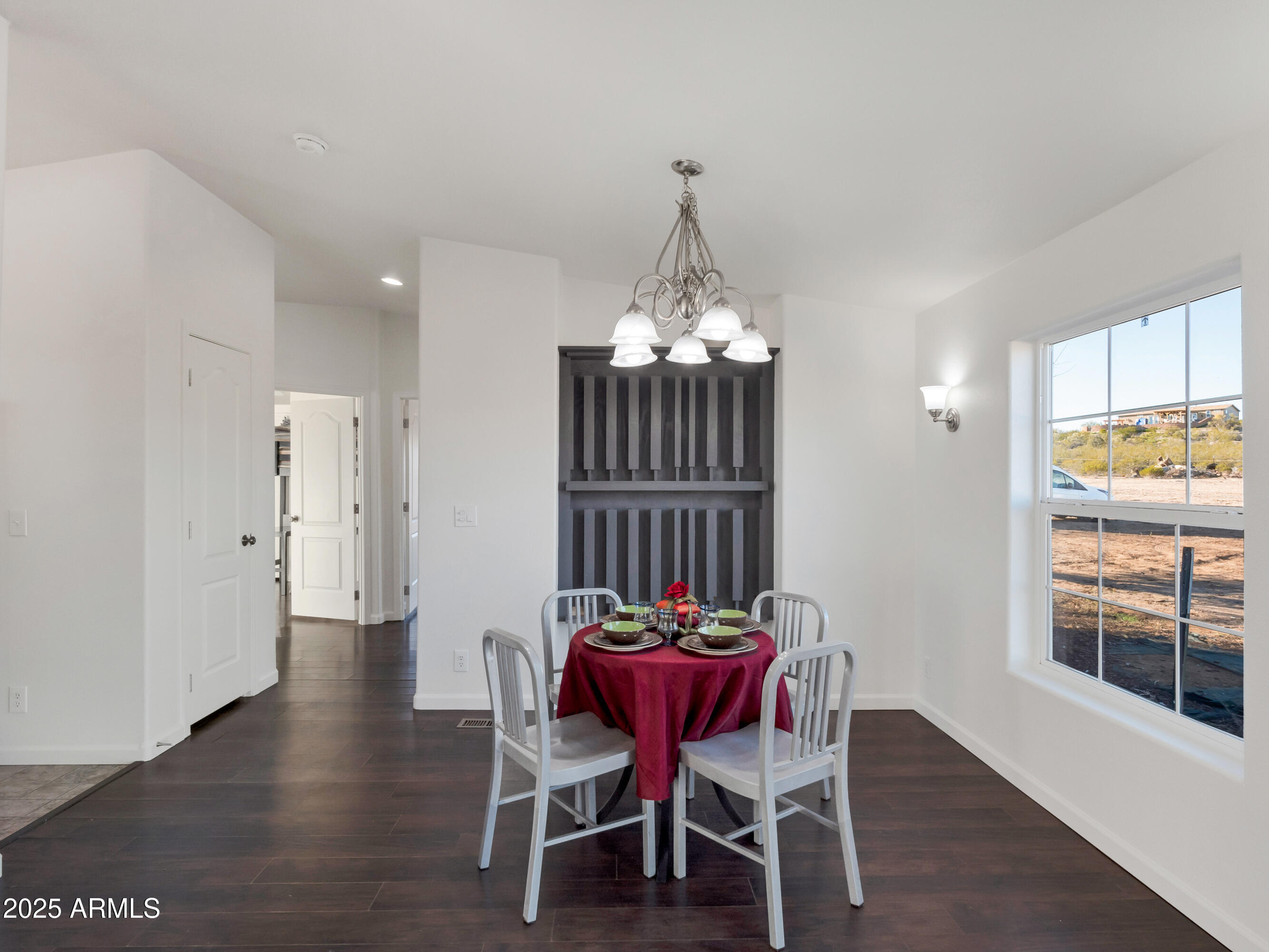 2164 East Liberty Trail Rimrock, AZ 86335 - Photo 11 of 36 a view of a dining room with furniture and wooden floor