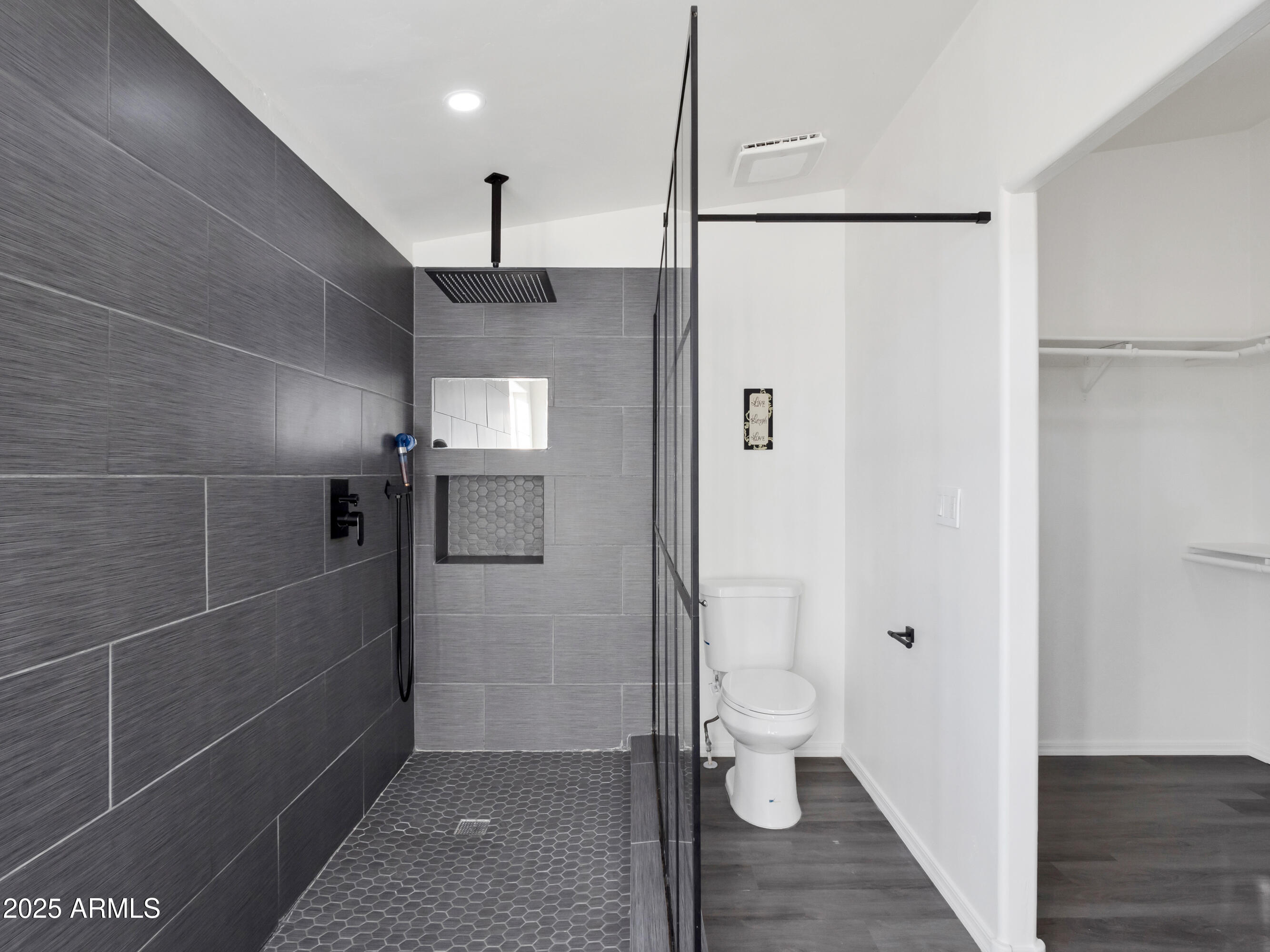 2164 East Liberty Trail Rimrock, AZ 86335 - Photo 19 of 36 a bathroom with a shower and a toilet