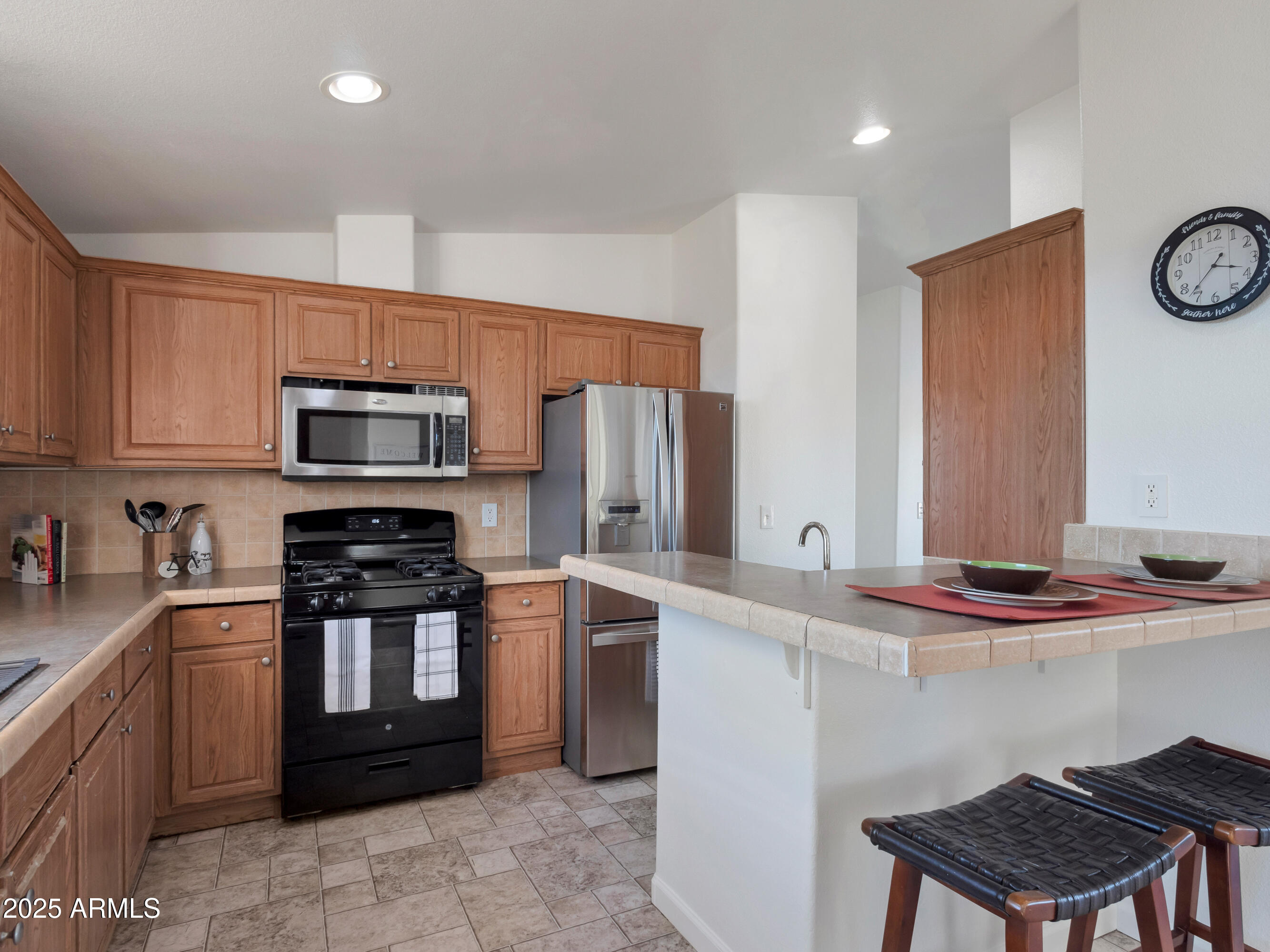 2164 East Liberty Trail Rimrock, AZ 86335 - Photo 7 of 36 a kitchen with stainless steel appliances granite countertop a stove a sink dishwasher and a refrigerator