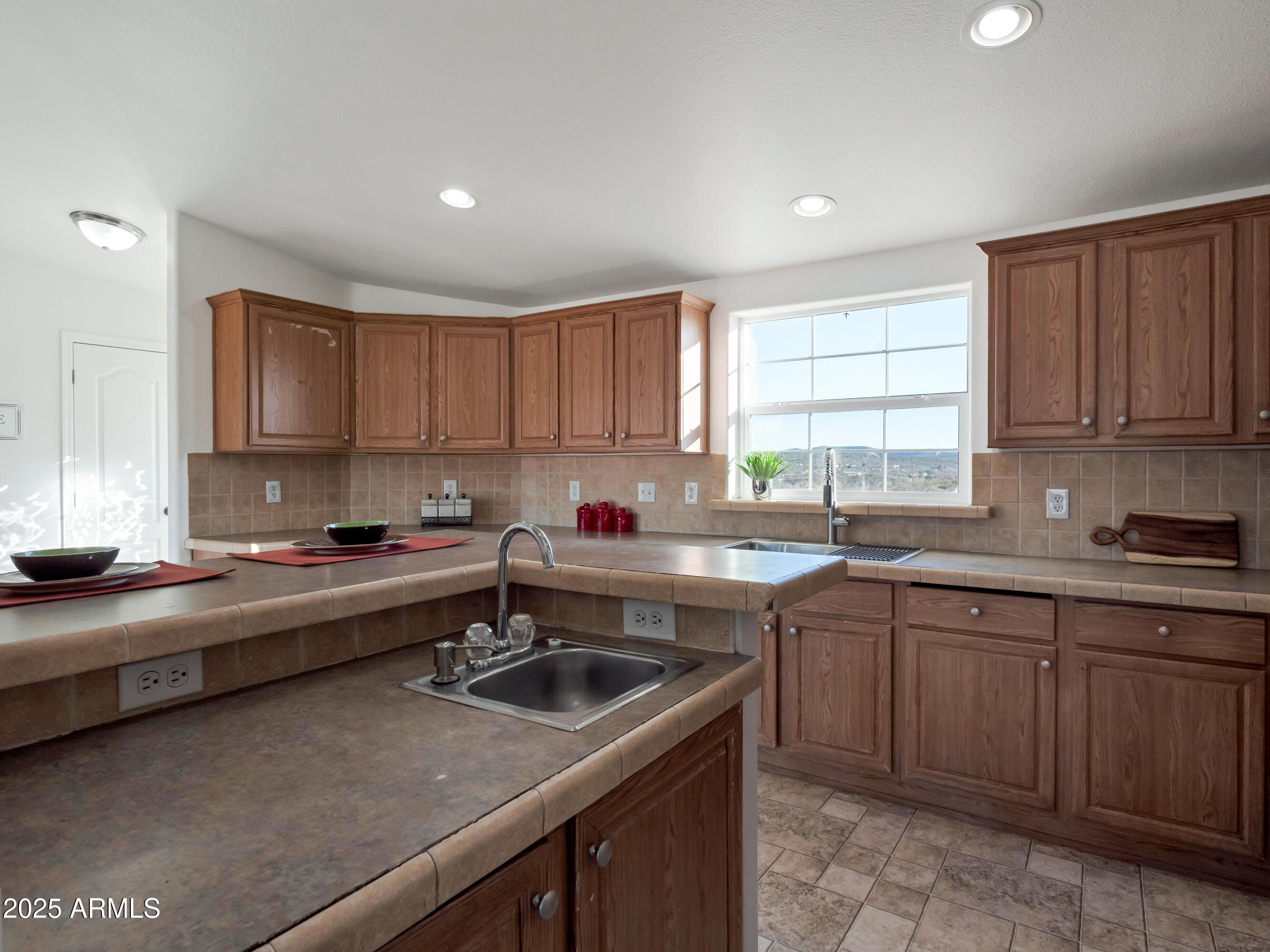 2164 East Liberty Trail Rimrock, AZ 86335 - Photo 9 of 36 a kitchen with a sink a stove and cabinets