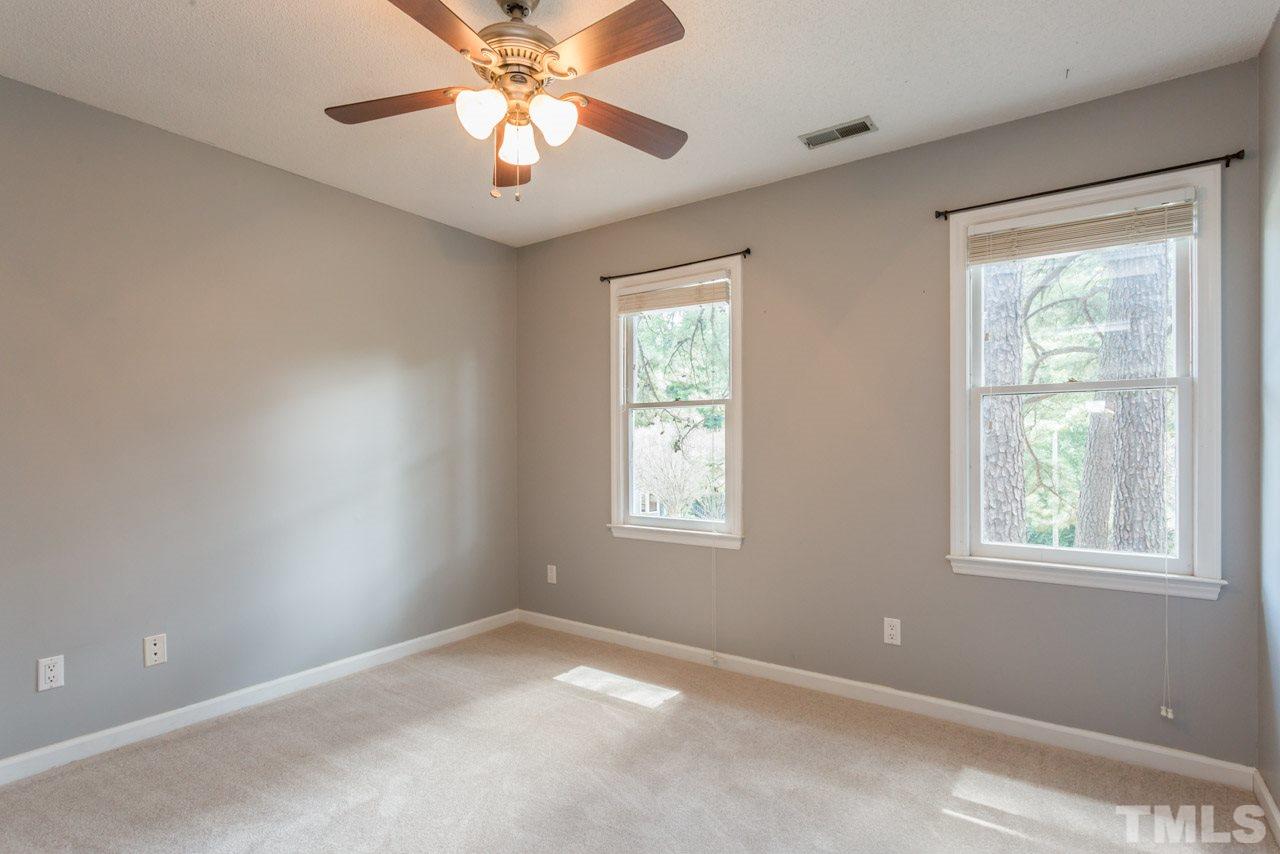 7308 Wilderness Road Raleigh, NC 27613 - Photo 13 of 25 a view of an empty room with a window