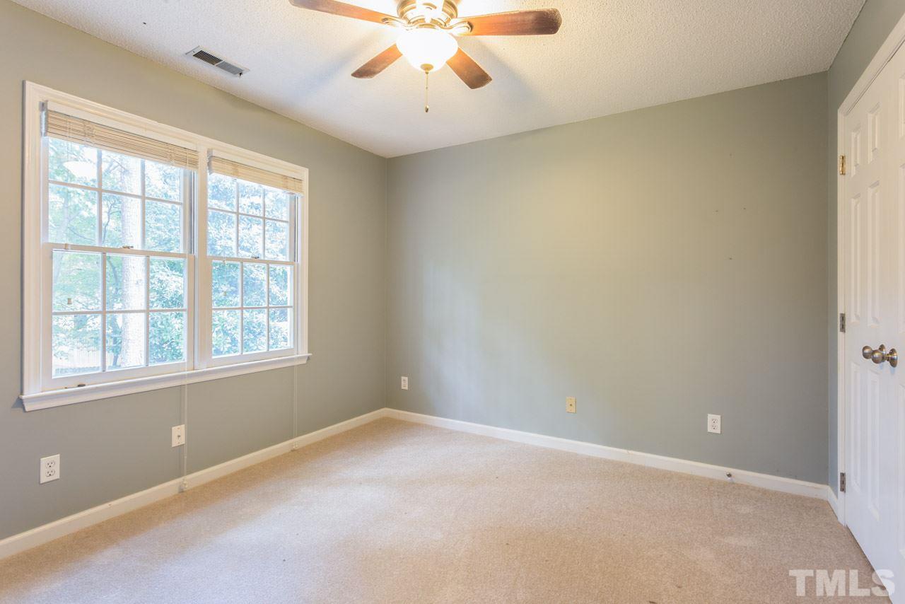 7308 Wilderness Road Raleigh, NC 27613 - Photo 14 of 25 an empty room with a window