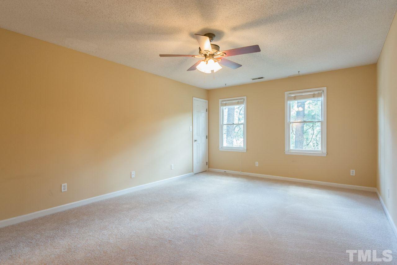 7308 Wilderness Road Raleigh, NC 27613 - Photo 17 of 25 a view of an empty room with a window