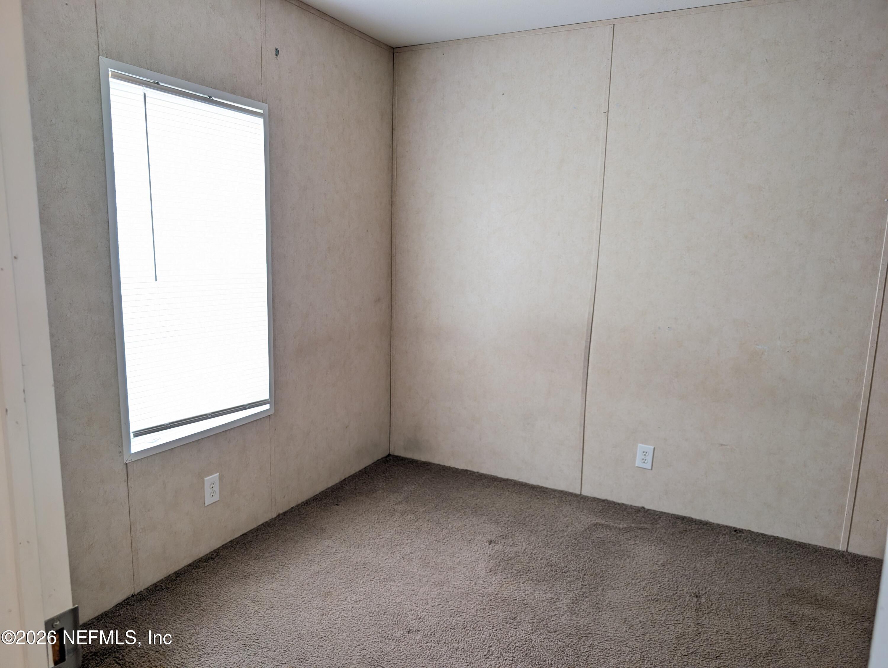 125 Hayman Drive Interlachen, FL 32148 - Photo 7 of 14 a view of an empty room and a window