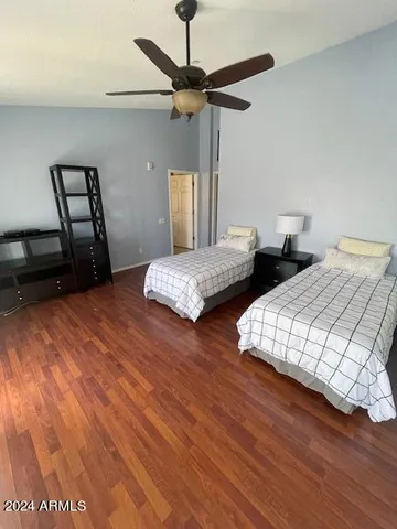 a kitchen with granite countertop a stove a sink and a refrigerator