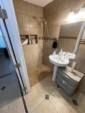 a bedroom with two beds and a window