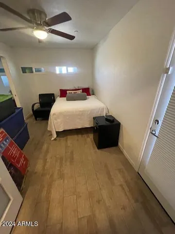 a bathroom with a sink and mirror with toilet