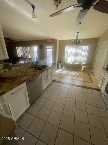 a bedroom with bed and window