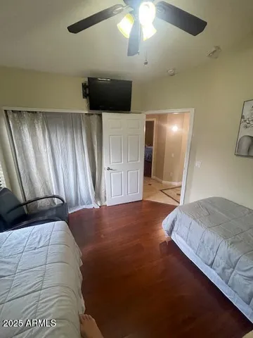 a bedroom with two beds and painted walls