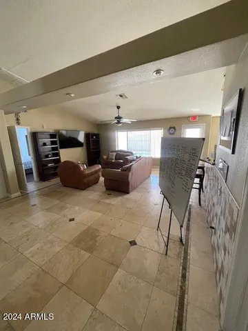 a view of a dining room with furniture and window