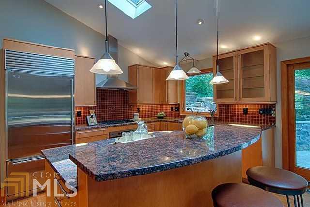 1748 Timberland Road Northeast, Unit 4 Atlanta, GA 30345 - Photo 1 of 1 a kitchen with stainless steel appliances granite countertop a sink a stove and a wooden cabinets