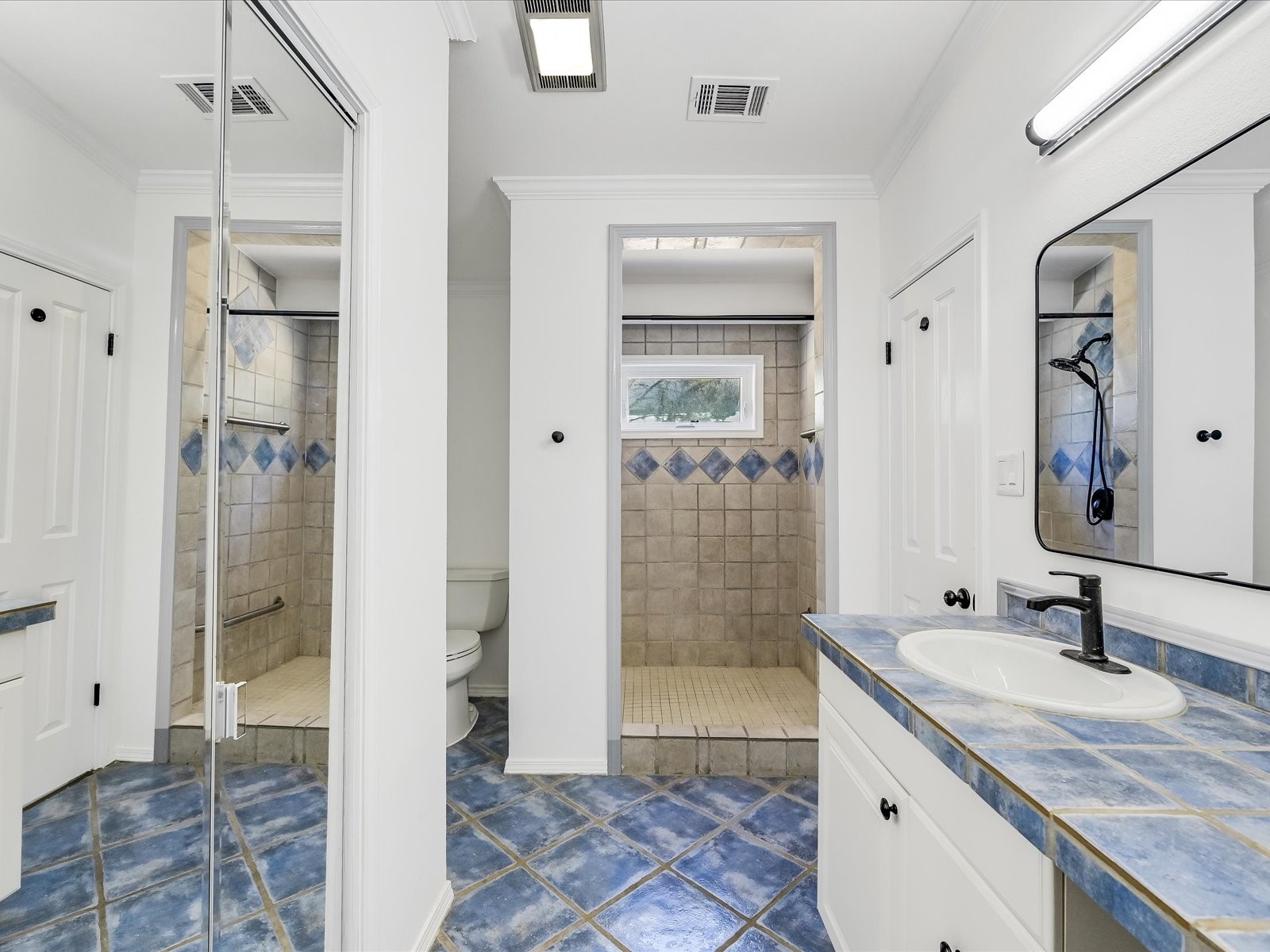 2712 Geronimo Trail Austin, TX 78734 - Photo 18 of 31 a bathroom with a granite countertop sink mirror and shower