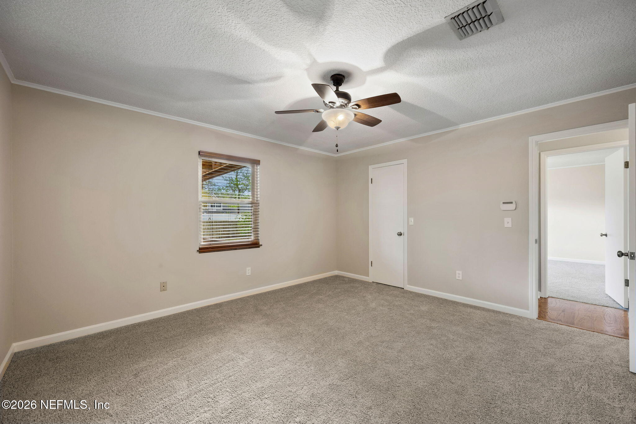 1888 Clemson Road Jacksonville, FL 32217 - Photo 11 of 41 a view of an empty room with a window