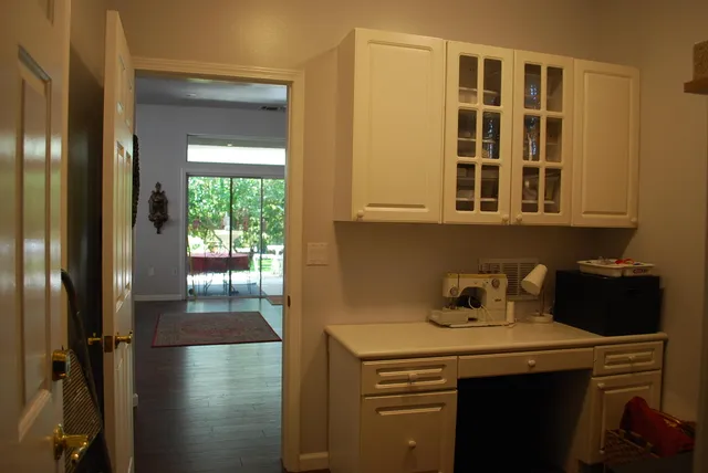 a kitchen with a refrigerator and a stove