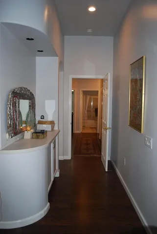 a view of a bathroom from a hallway