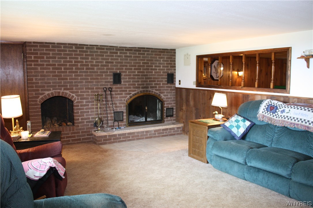 2831 Lower Mountain Road Lewiston, NY 14131 - Photo 30 of 44 Basement family room with woodburning fireplace
