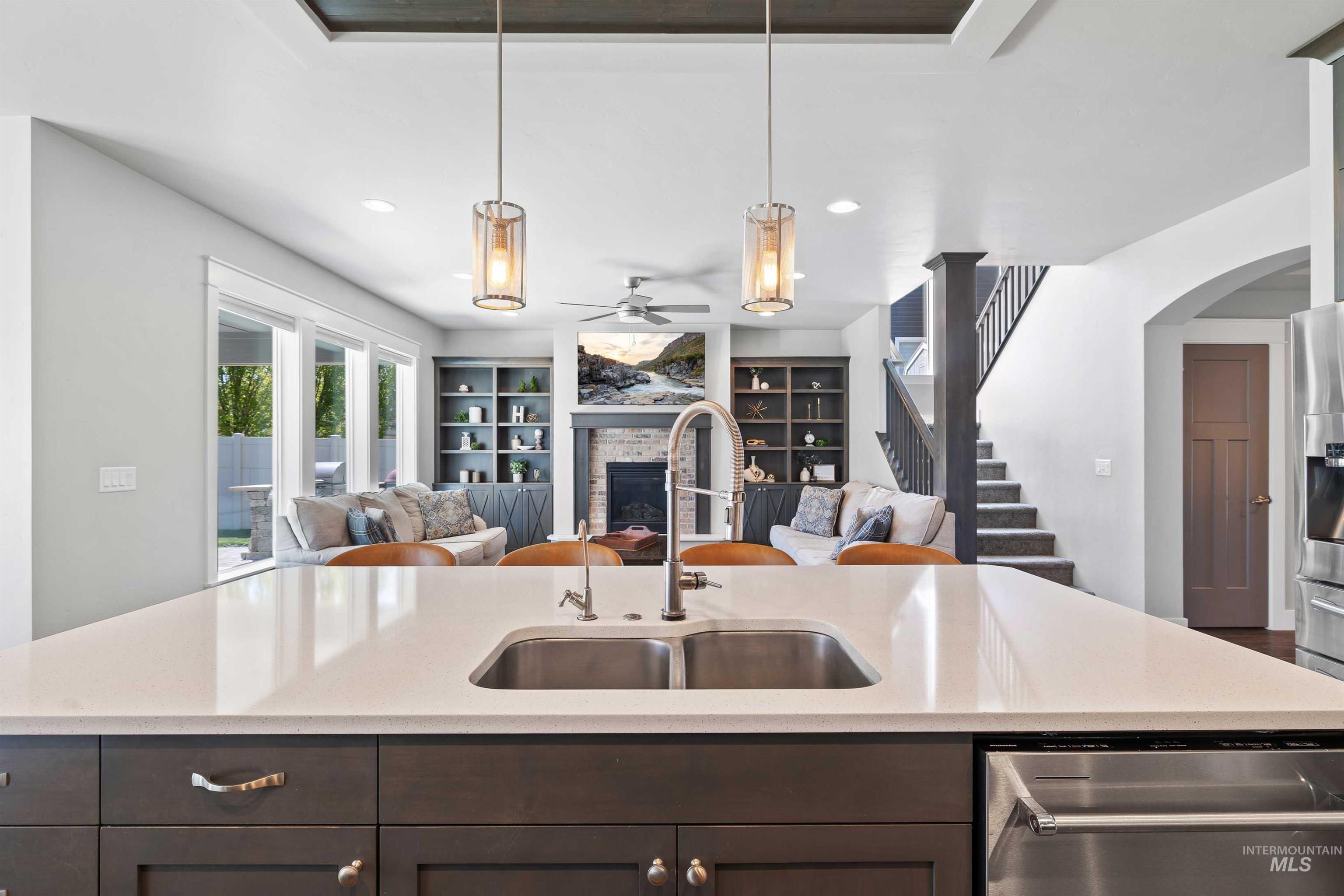 2441 Blick Lane Twin Falls, ID 83301 - Photo 11 of 50 Kitchen island with a white countertop and undermount stainless steel sink
