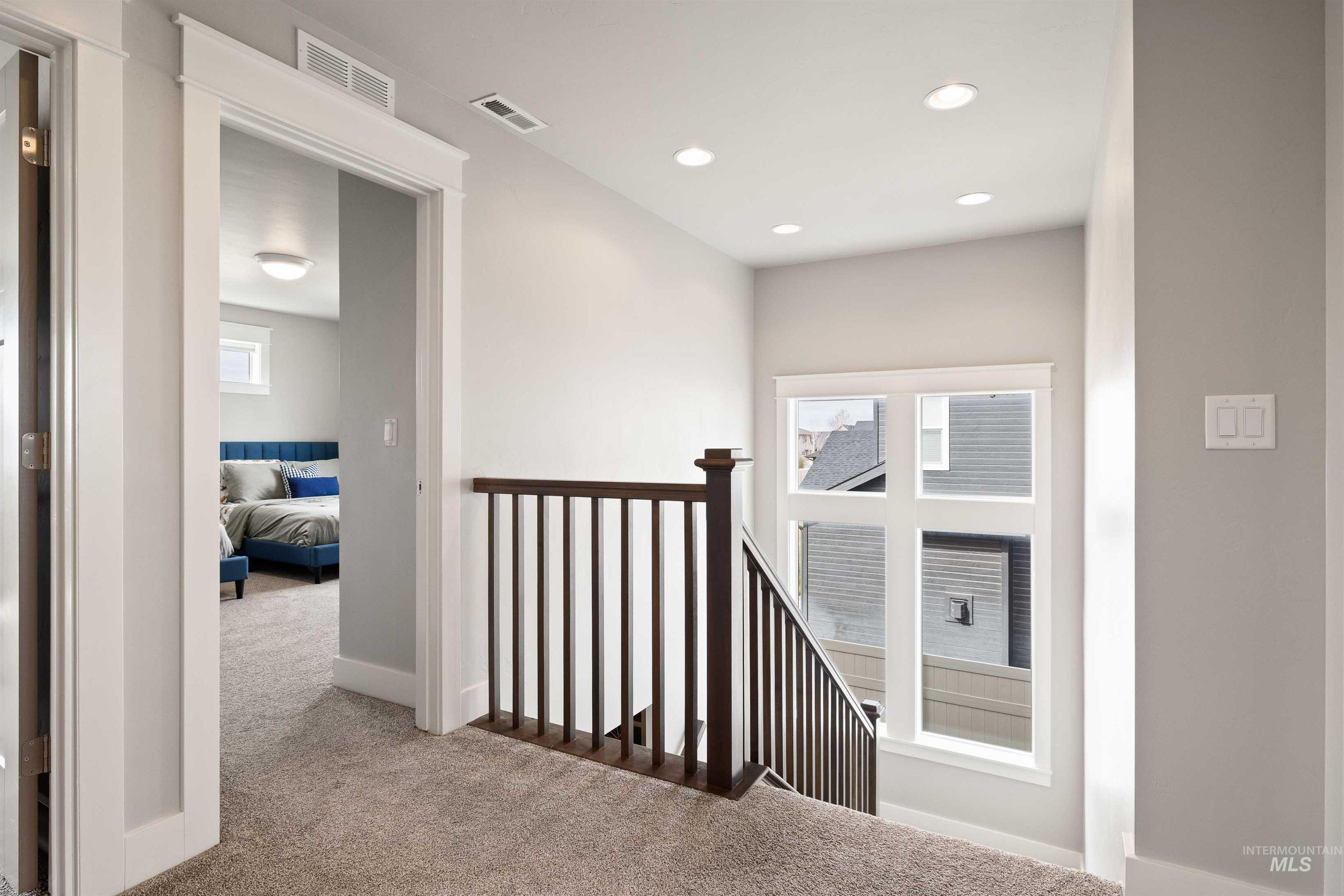 2441 Blick Lane Twin Falls, ID 83301 - Photo 20 of 50 Corridor featuring light carpet, an upstairs landing, and recessed lighting