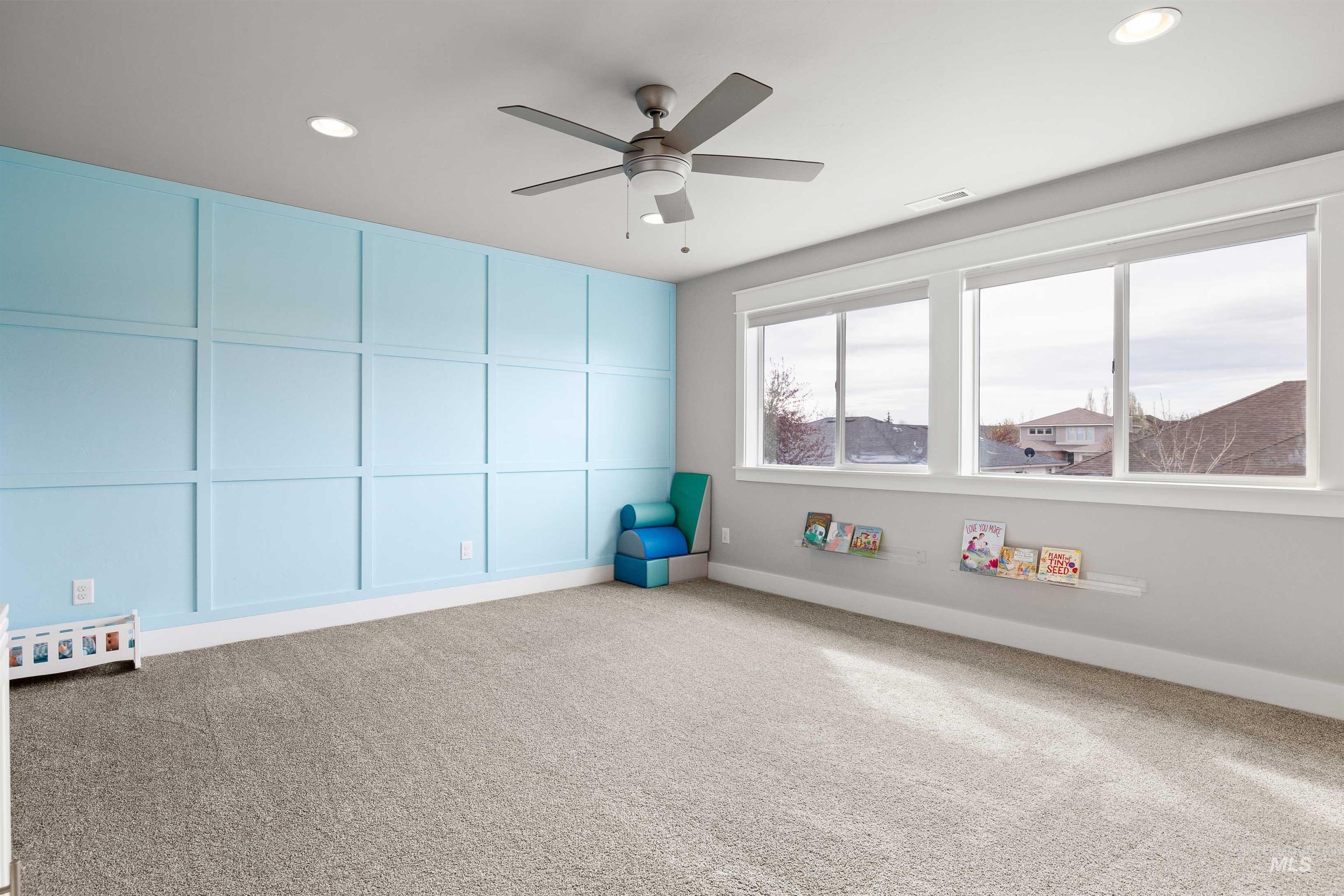 2441 Blick Lane Twin Falls, ID 83301 - Photo 28 of 50 Empty room featuring a decorative wall, carpet flooring, a ceiling fan, and recessed lighting