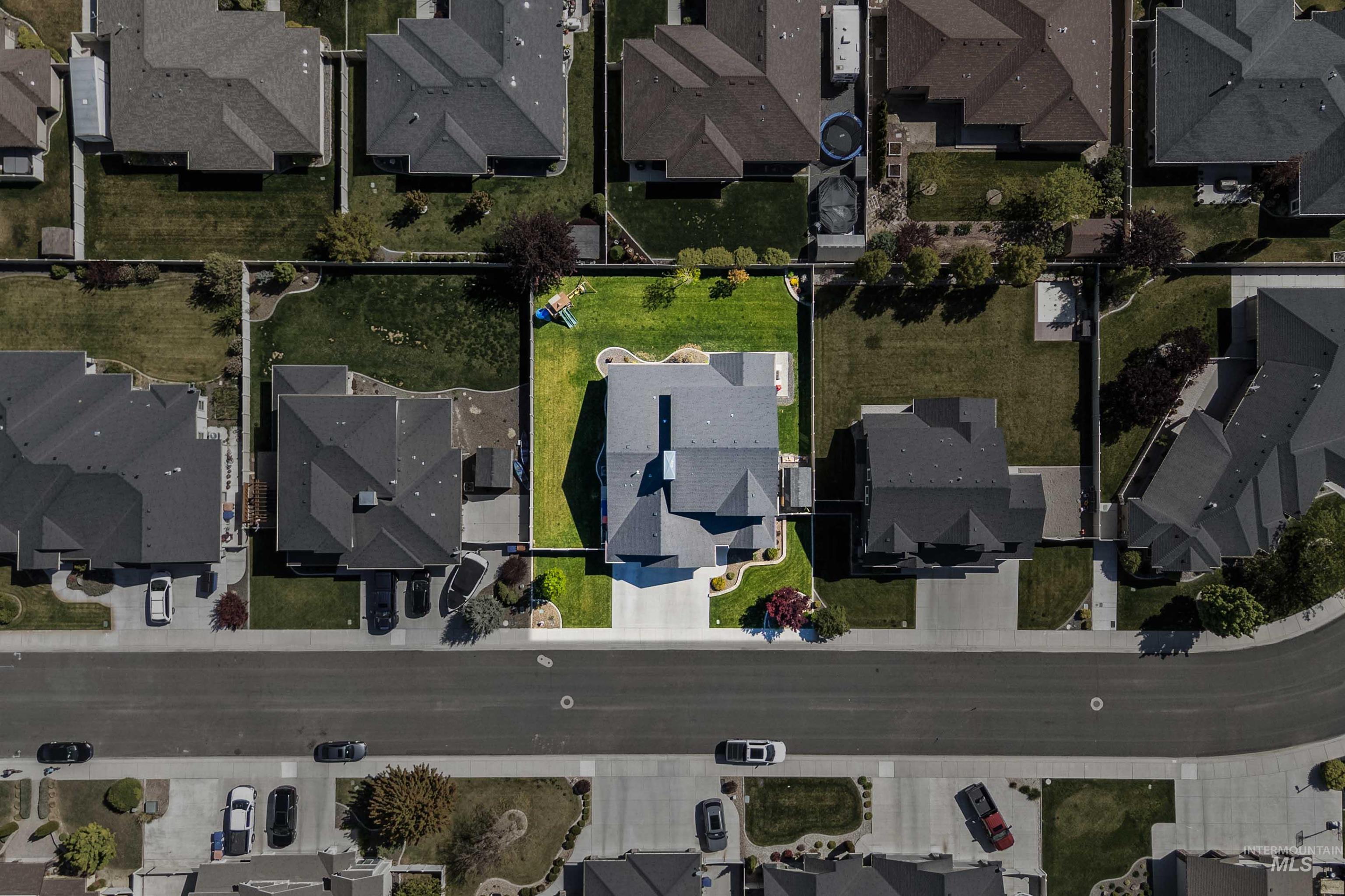 2441 Blick Lane Twin Falls, ID 83301 - Photo 50 of 50 Aerial perspective showcasing a residential property with a multi-gabled roof and a light-colored driveway