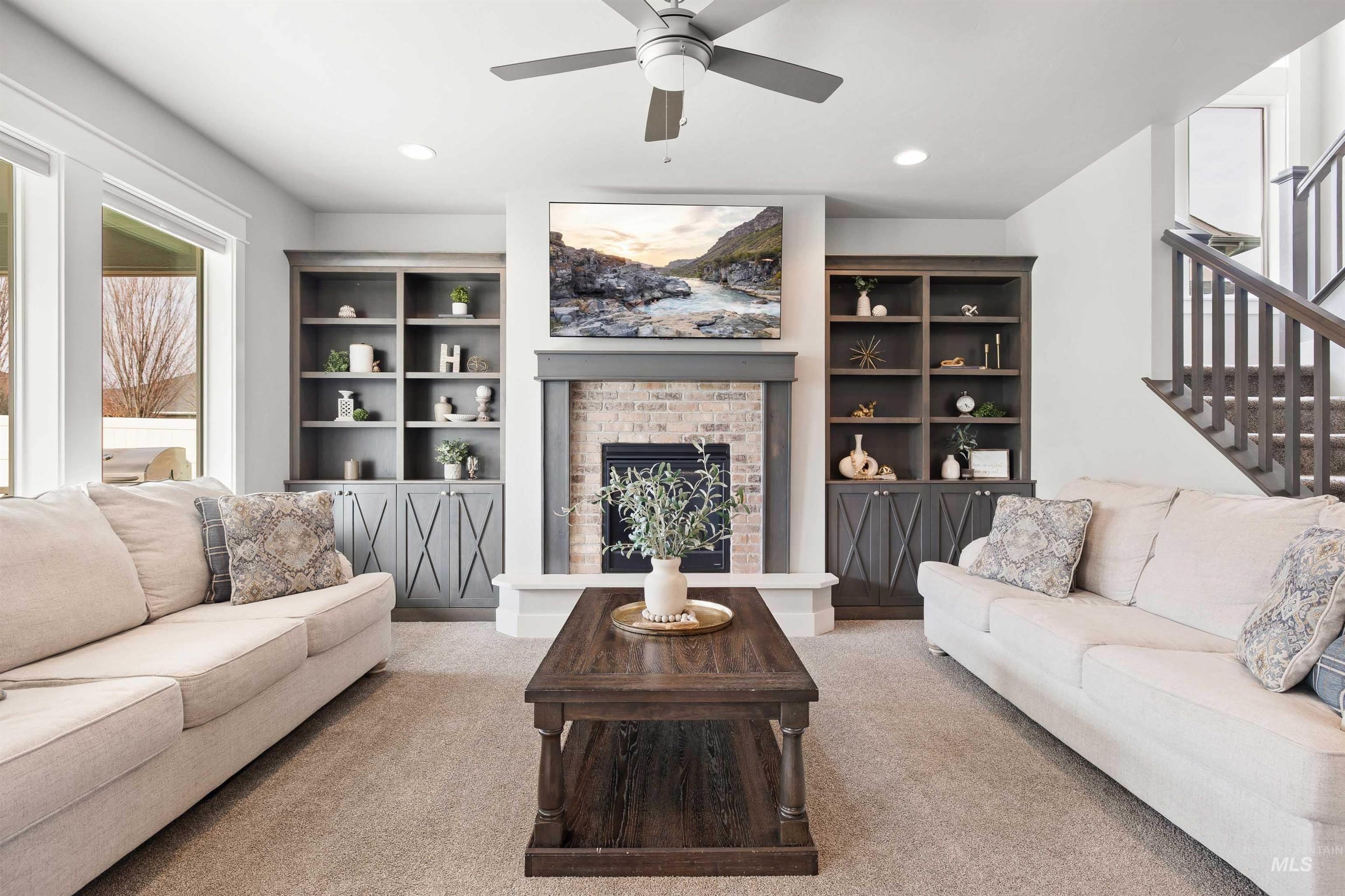2441 Blick Lane Twin Falls, ID 83301 - Photo 6 of 50 Living room featuring a ceiling fan, a brick fireplace, and carpet floors