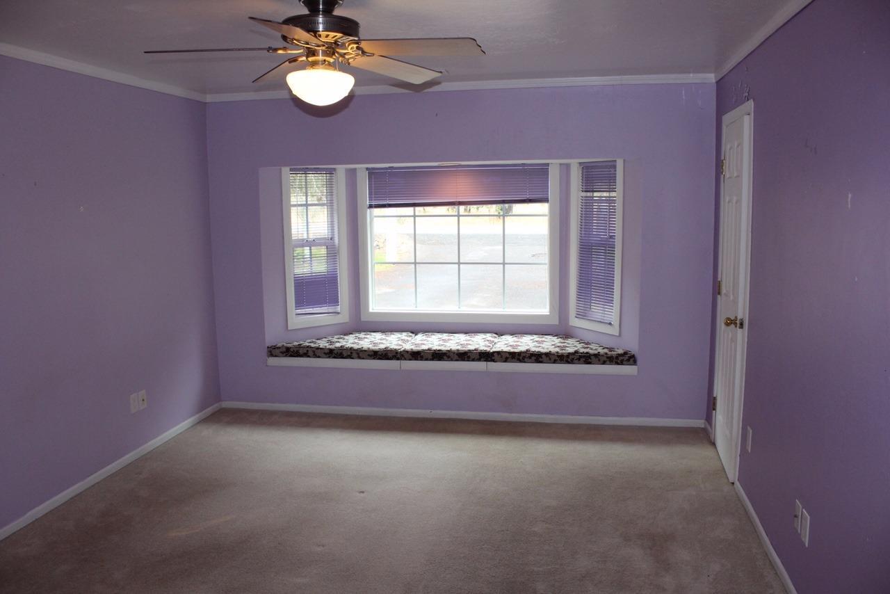 14841 Agate Road Eagle Point, OR 97524 - Photo 23 of 25 an empty room with a fan and a window