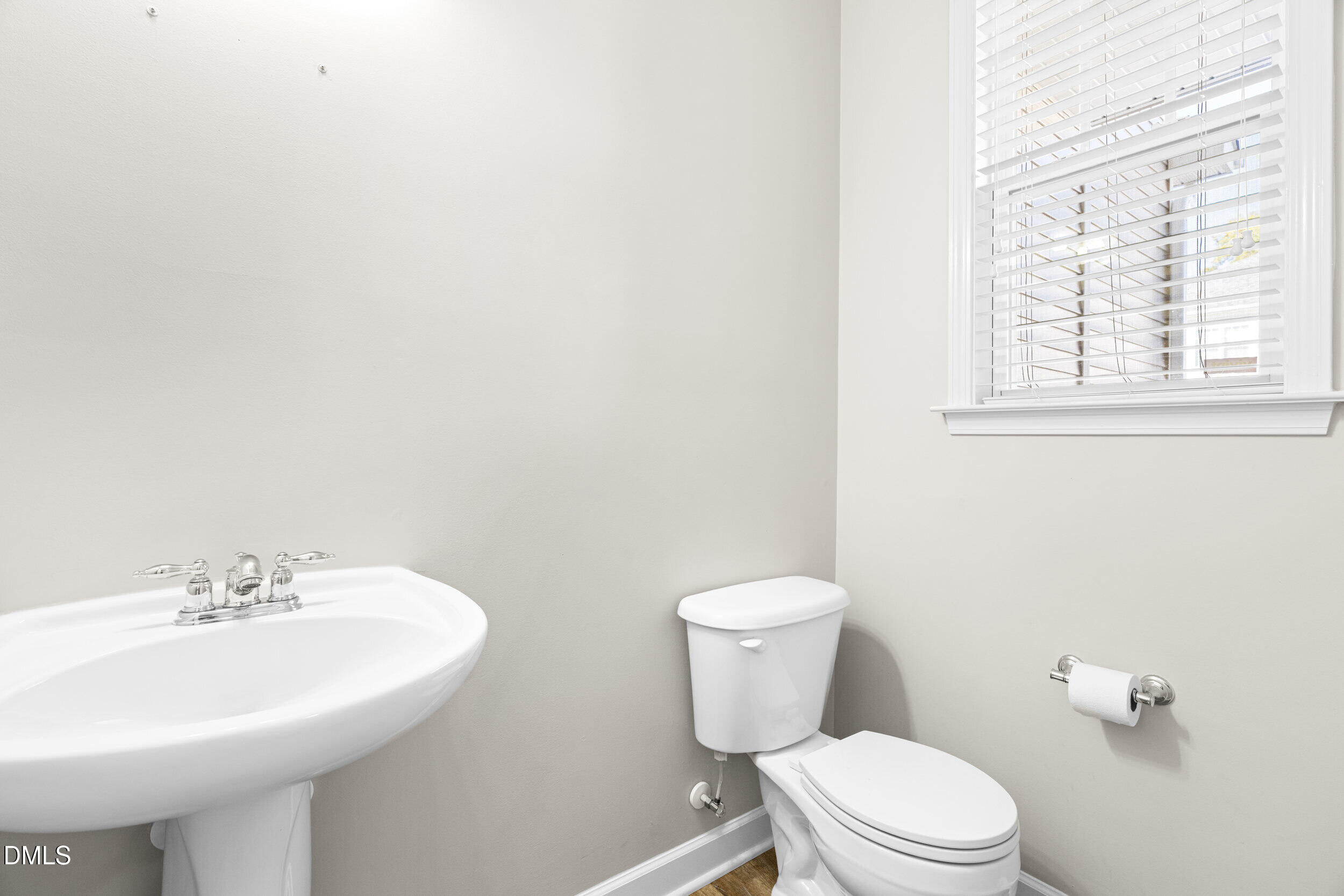 2522 Spring Oaks Way Raleigh, NC 27614 - Photo 14 of 30 a bathroom with a sink a toilet and a mirror