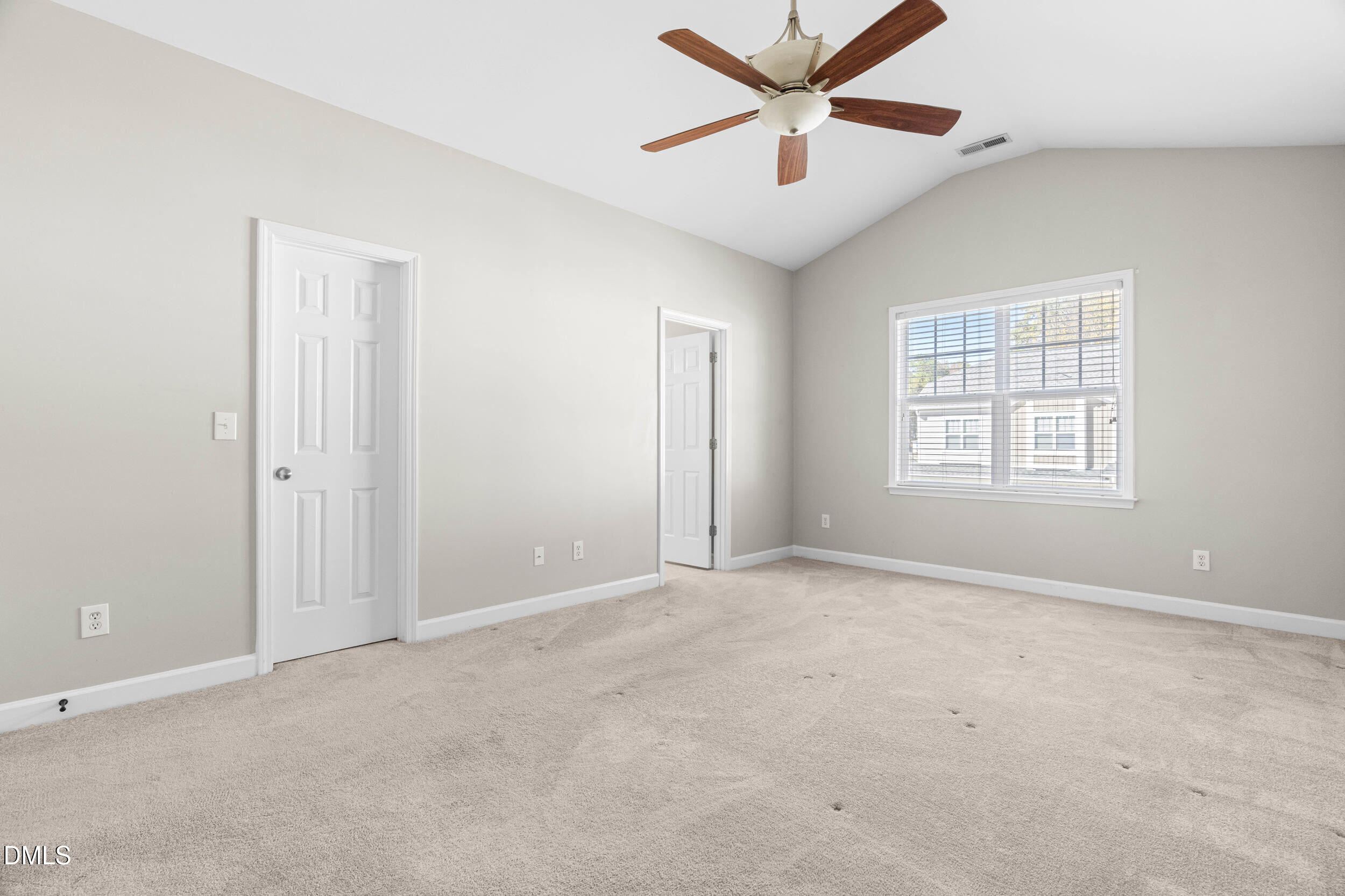 2522 Spring Oaks Way Raleigh, NC 27614 - Photo 17 of 30 an empty room with windows and fan