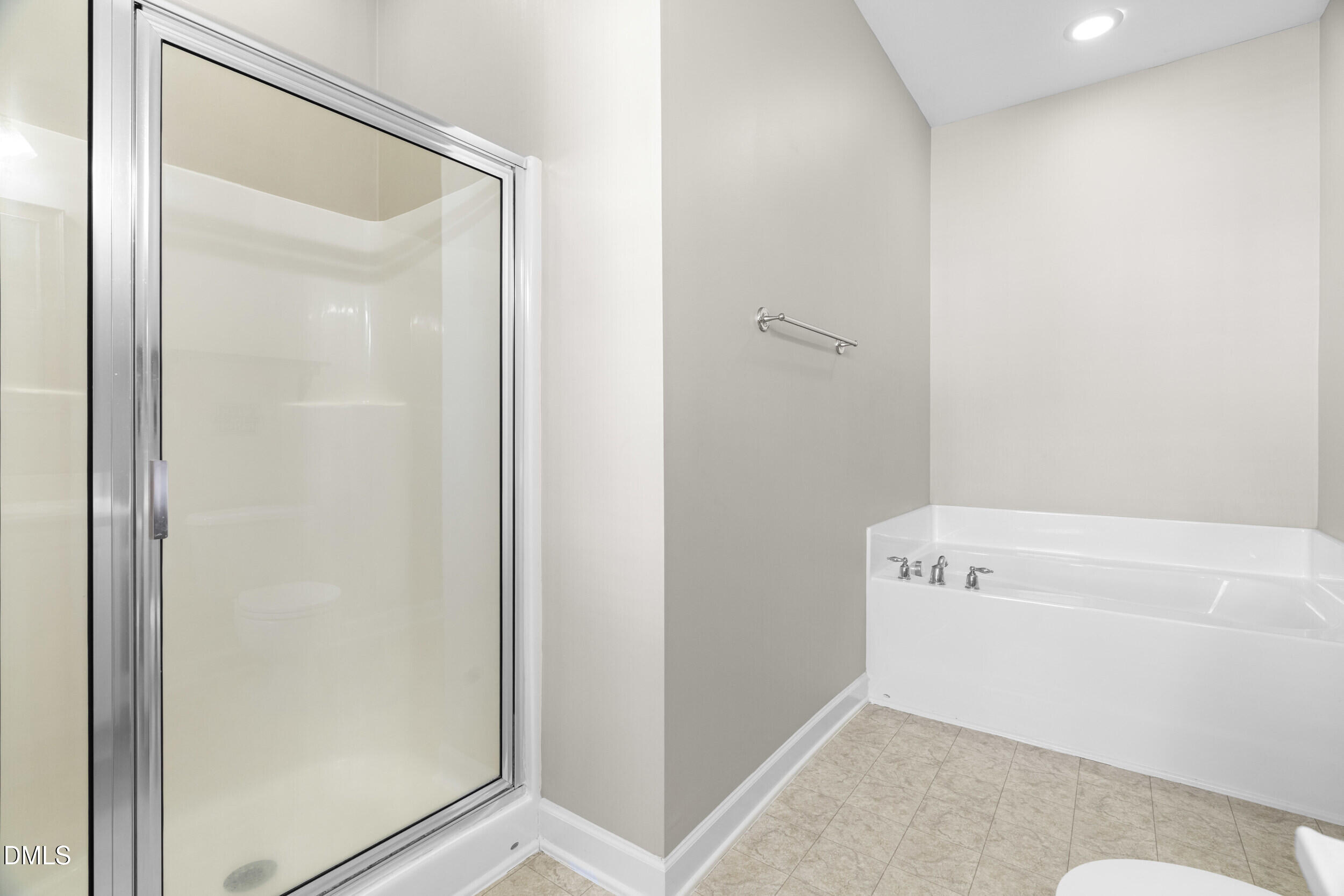 2522 Spring Oaks Way Raleigh, NC 27614 - Photo 20 of 30 a bathroom with a tub and a shower