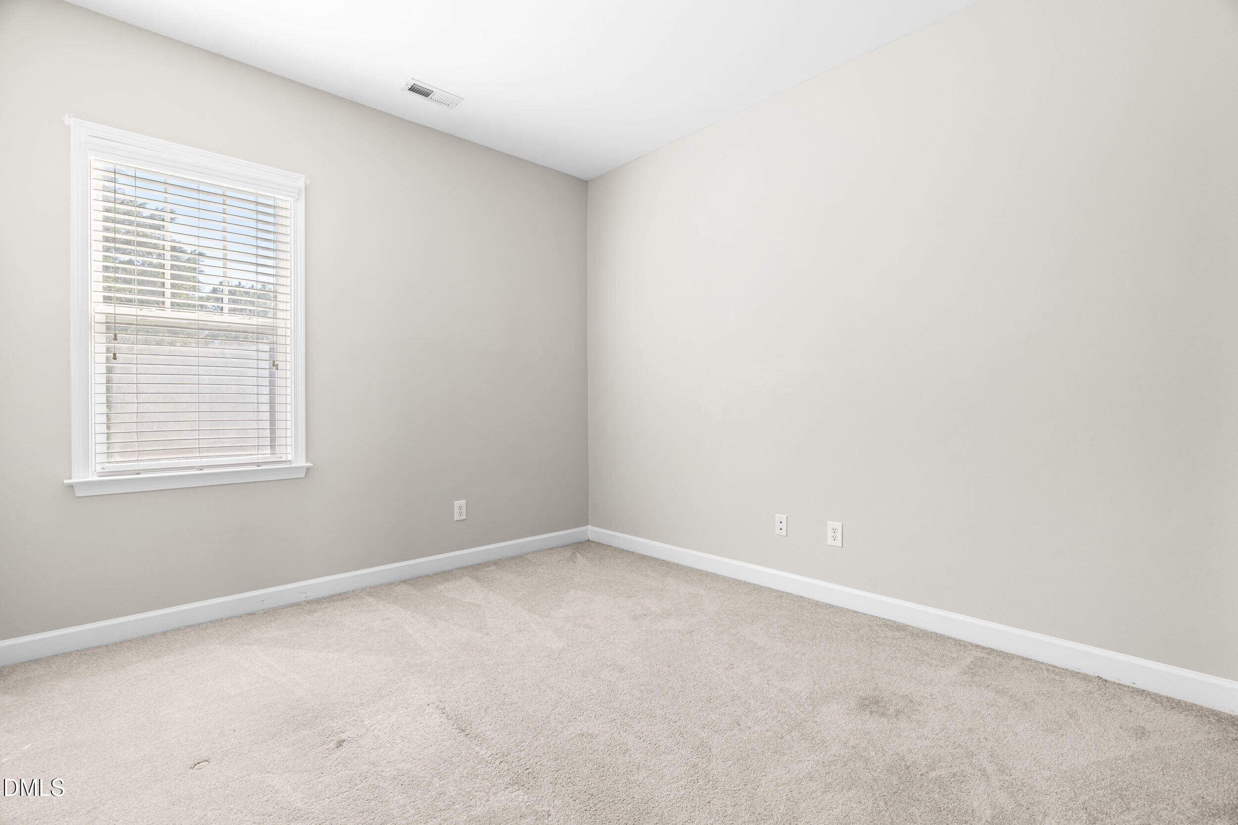 2522 Spring Oaks Way Raleigh, NC 27614 - Photo 21 of 30 an empty room with a window