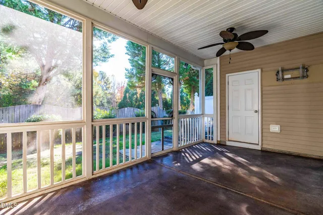 a view of a porch with wooden floor and outdoor space