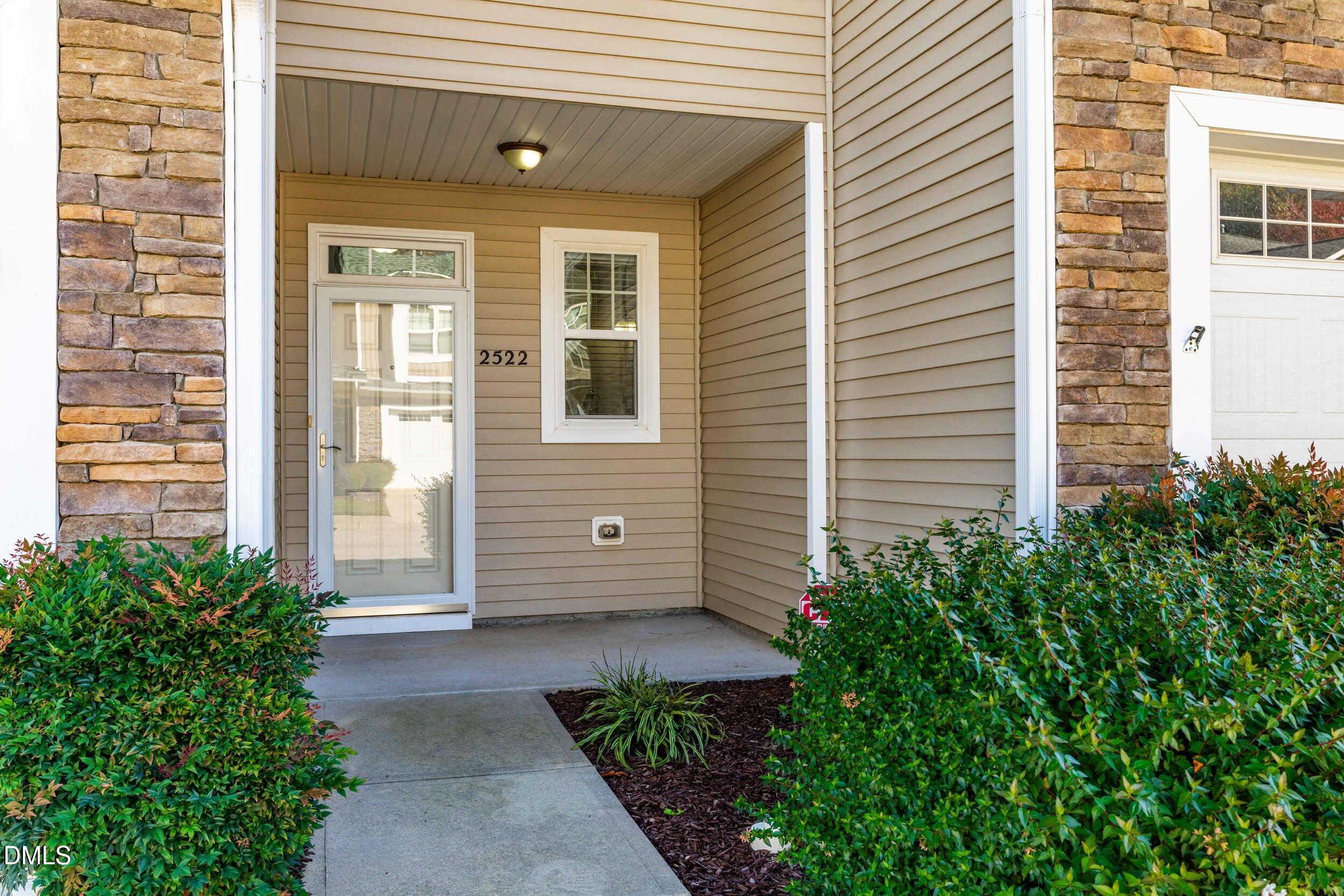 2522 Spring Oaks Way Raleigh, NC 27614 - Photo 5 of 30 a view of a house with potted plants