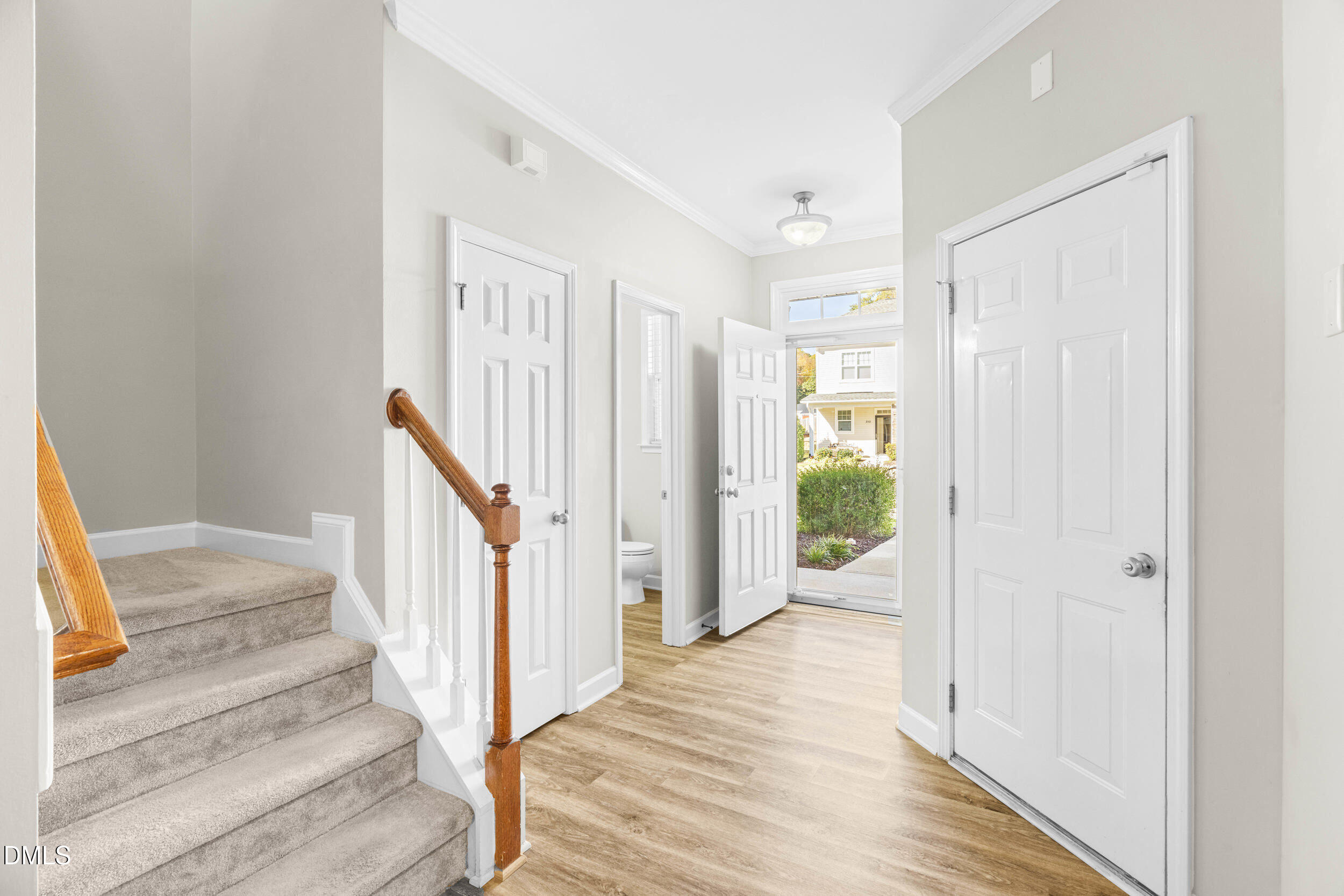 2522 Spring Oaks Way Raleigh, NC 27614 - Photo 9 of 30 a view of a hallway with wooden floor and entryway