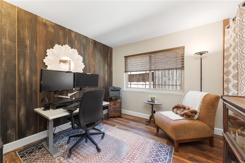 4384 Mill Valley Road Moorpark, CA 93021 - Photo 17 of 32 a living room with furniture a window and a flat screen tv
