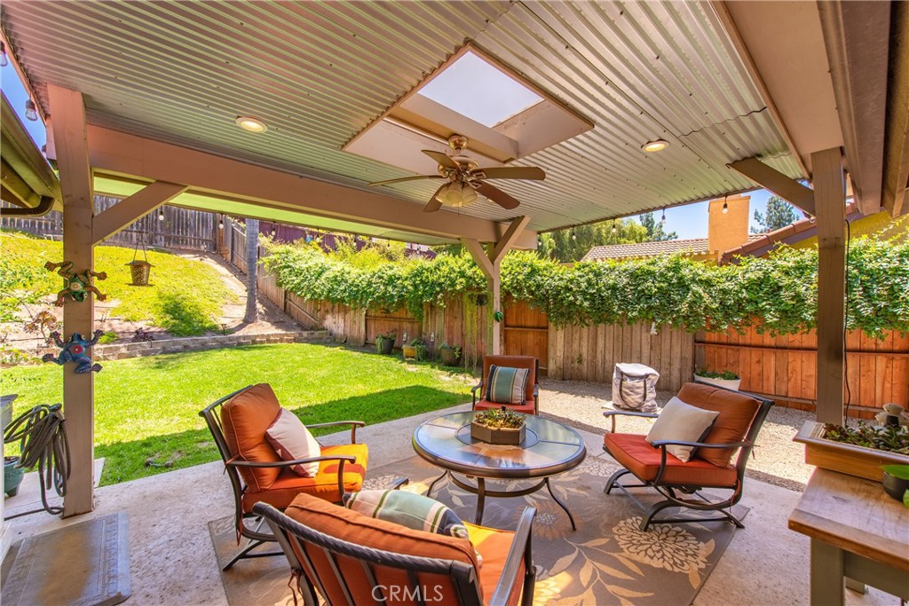 4384 Mill Valley Road Moorpark, CA 93021 - Photo 25 of 32 a view of an outdoor sitting area with furniture and umbrella
