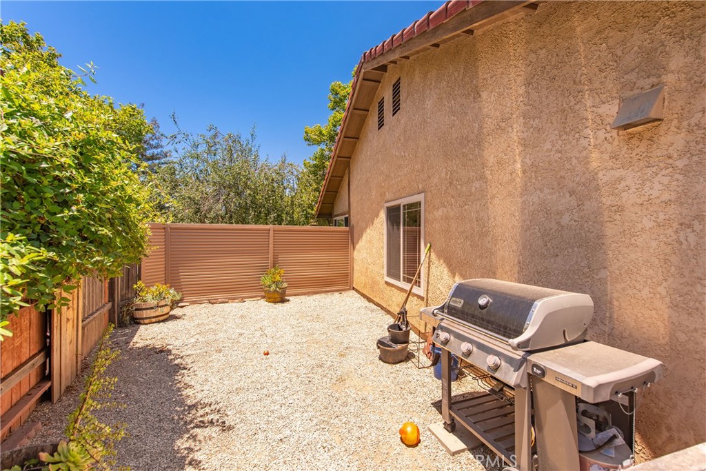 4384 Mill Valley Road Moorpark, CA 93021 - Photo 32 of 32 a backyard of a house with table and chairs