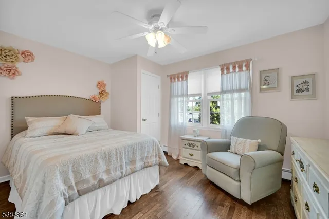 a bedroom with a bed couch and a window