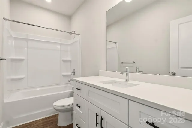 a bathroom with a sink a toilet and a bathtub