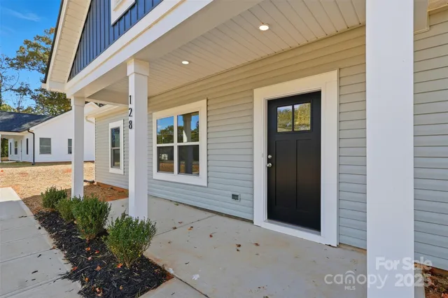 front view of a house with a large window